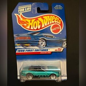 1998 first edition Hot Wheels green Jaguar XK8 model in 1:64 scale.